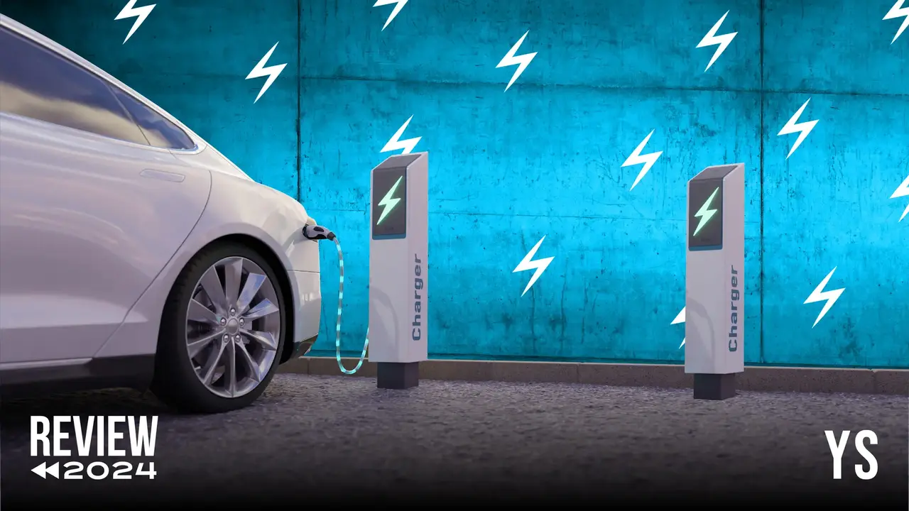 Two mint chocolate milkshakes with whipped cream and green sprinkles.