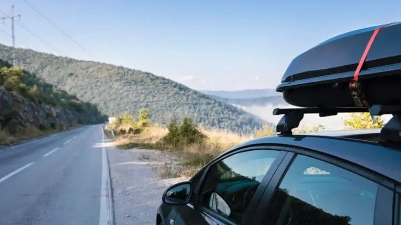 Close up on a plate of mashed potatoes, topped with baked pork chops with cream of mushroom soup, and a side of green beans.
