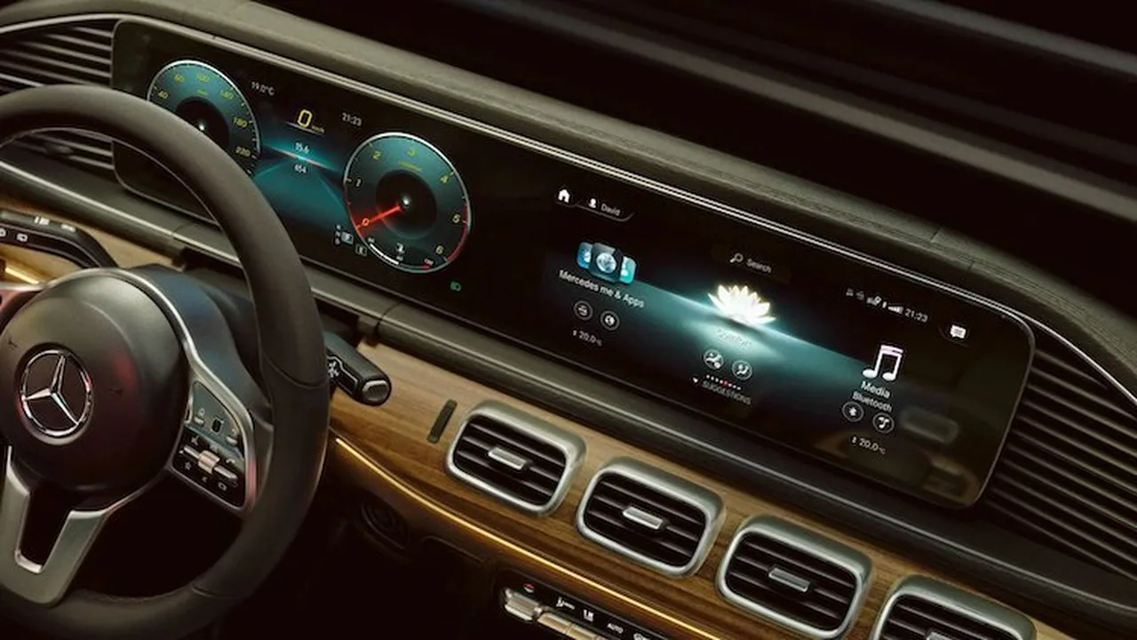 blue bowl of black bean beef tortilla soup on a board with cilantro and shredded cheese in background