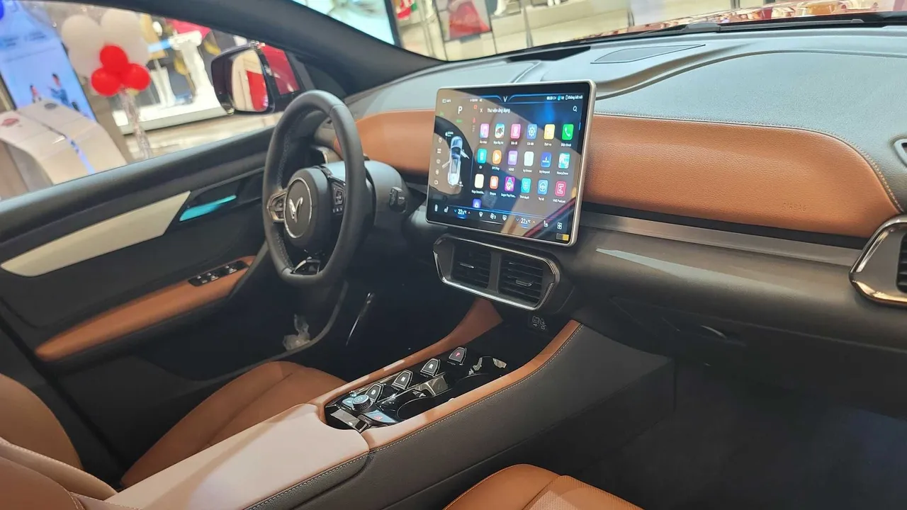 blue bowl of black bean beef tortilla soup on a board with cilantro and shredded cheese in background