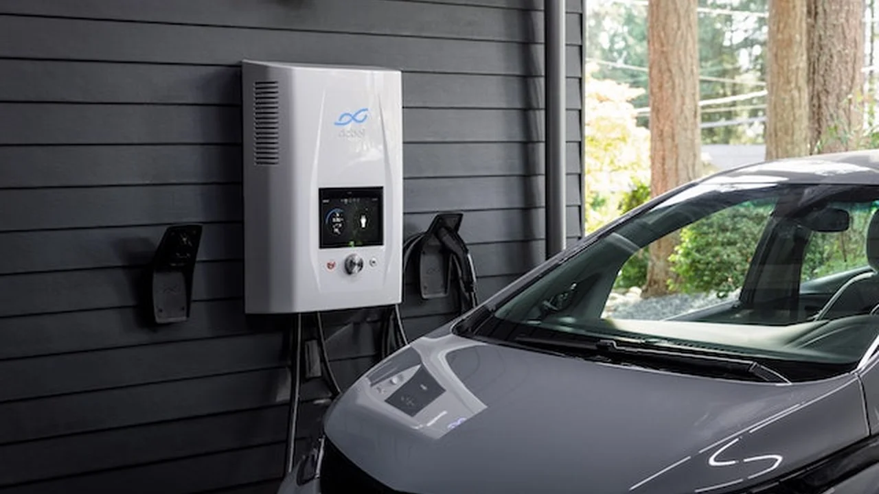 Close up on a plate of mashed potatoes, topped with baked pork chops with cream of mushroom soup, and a side of green beans.